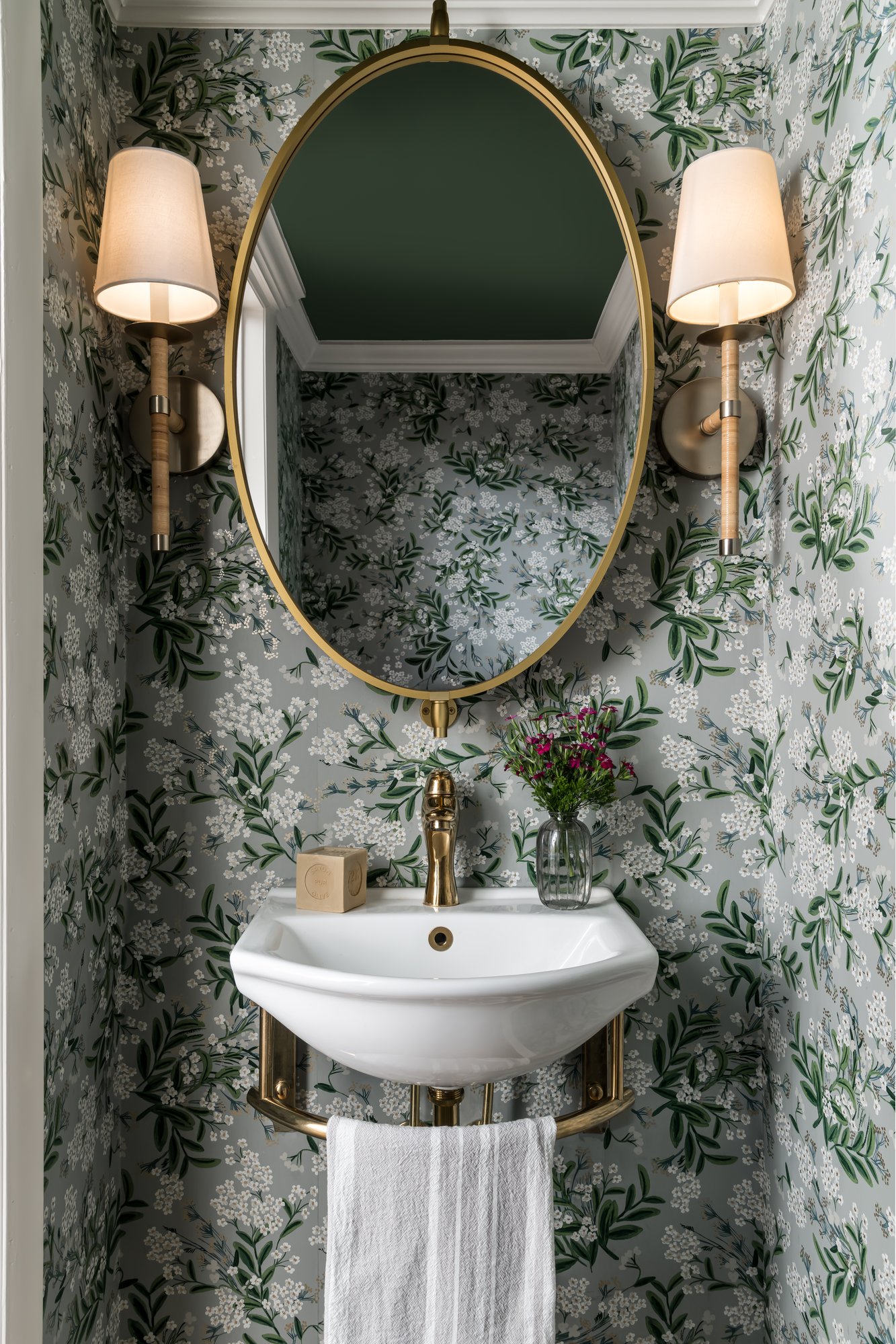 Image of a vanity with a basin-style sink and brass fixtures