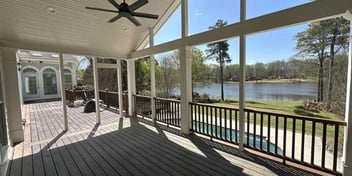 A covered deck of an Atlanta home with a waterfront view