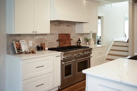 Full kitchen renovation with custom cabinetry and tile details by Exodus Design Build in Decatur, GA.