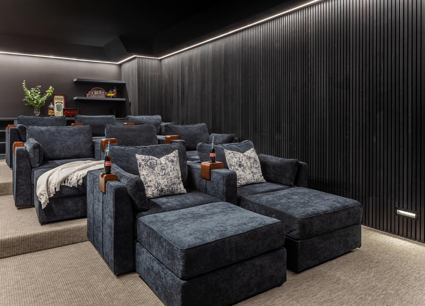 Luxury home theater with tiered seating and custom lighting by Exodus Design Build in Atlanta, GA. Luxury home theater with tiered seating and custom lighting by Exodus Design Build in Atlanta, GA.