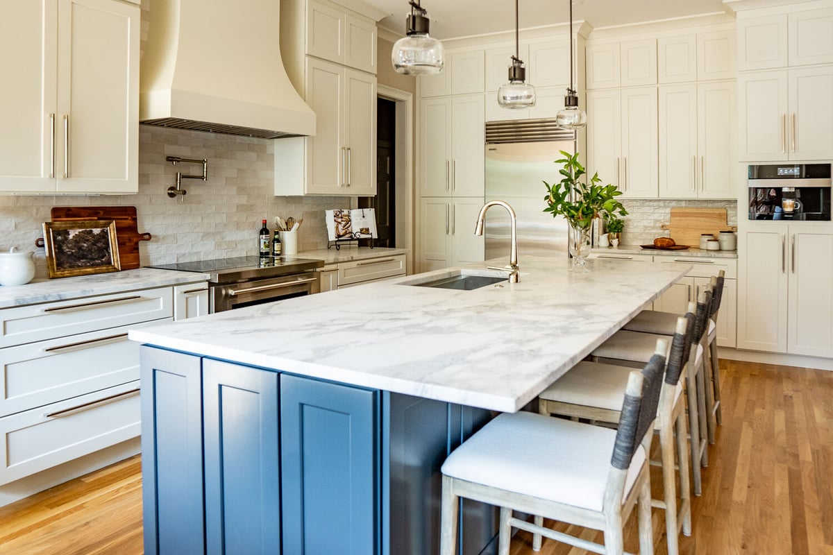 Custom kitchen design with blue island and marble countertops by Exodus Design Build in Lawrenceville, GA