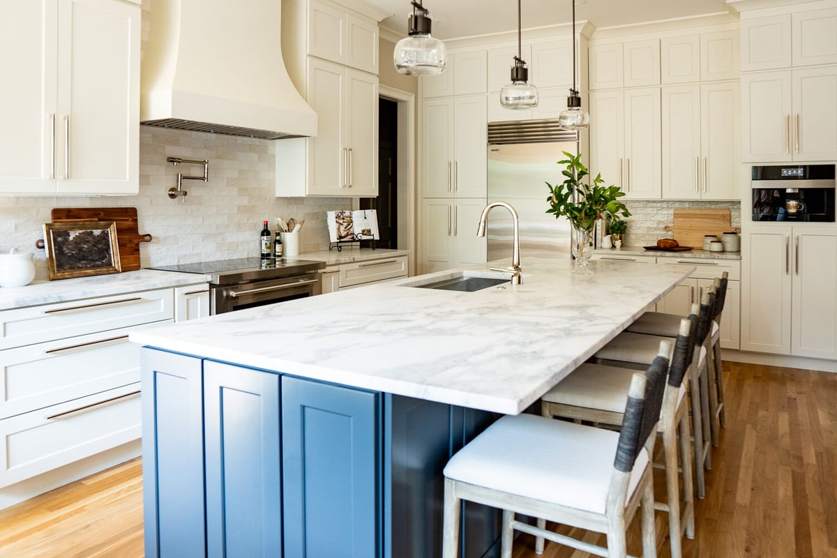 White and blue custom kitchen with oversized island designed by Exodus Design Build in Suwanee, GA