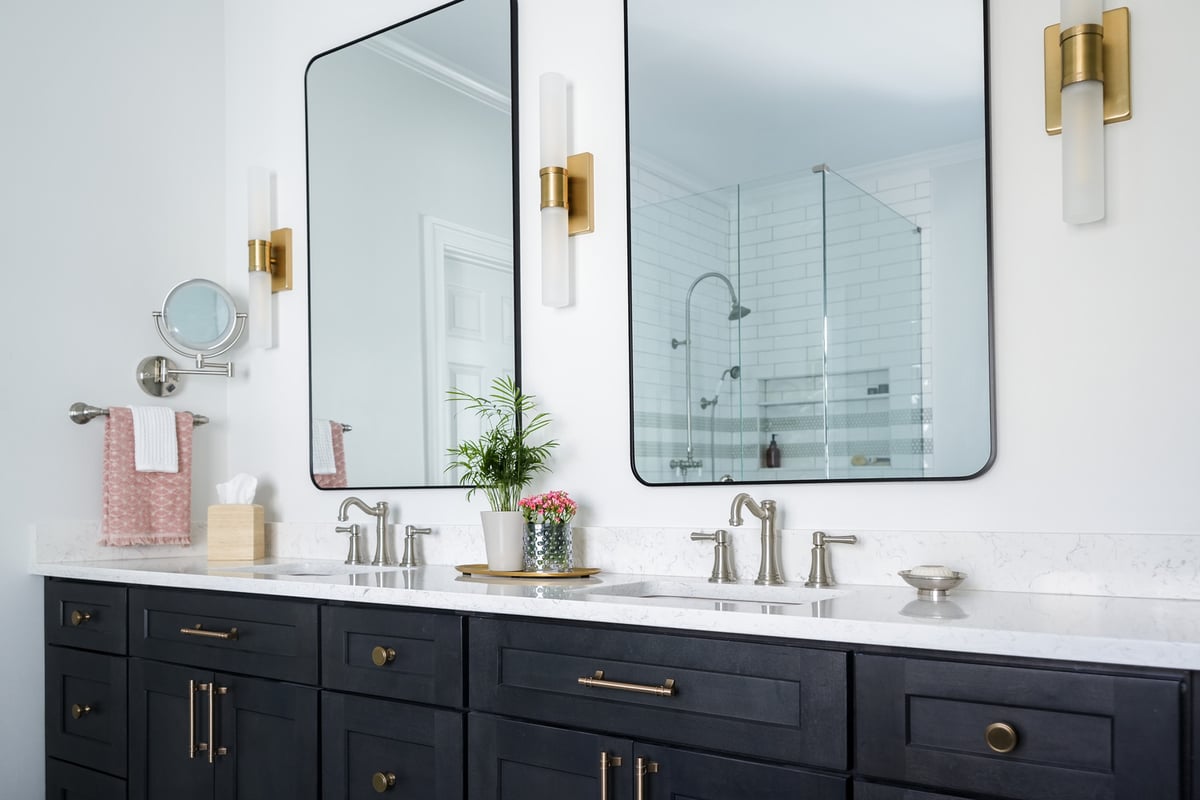 Close-up of modern bathroom vanity with brushed nickel faucets by Exodus Design Build in Loganville, GA.