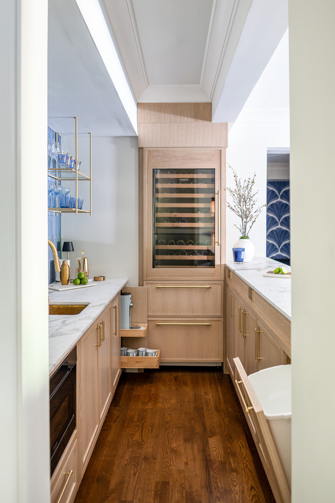 Custom wet bar cabinetry with drawers open, designed by Exodus Design Build in Redan, GA