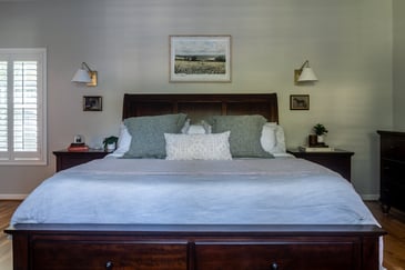Front-facing view of remodeled bedroom with symmetrical nightstands in Peachtree Corners, GA by Exodus Design Build.