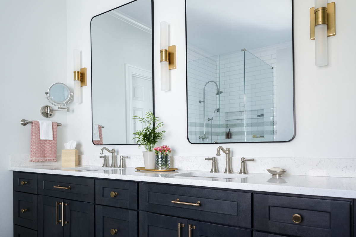 Bathroom mirror and lighting design with upscale fixtures by Exodus Design Build in Atlanta custom home