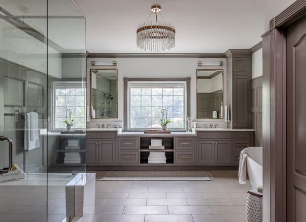 Spacious double vanity bathroom with chandelier lighting in a Fayetteville, GA custom home by Exodus Design Build