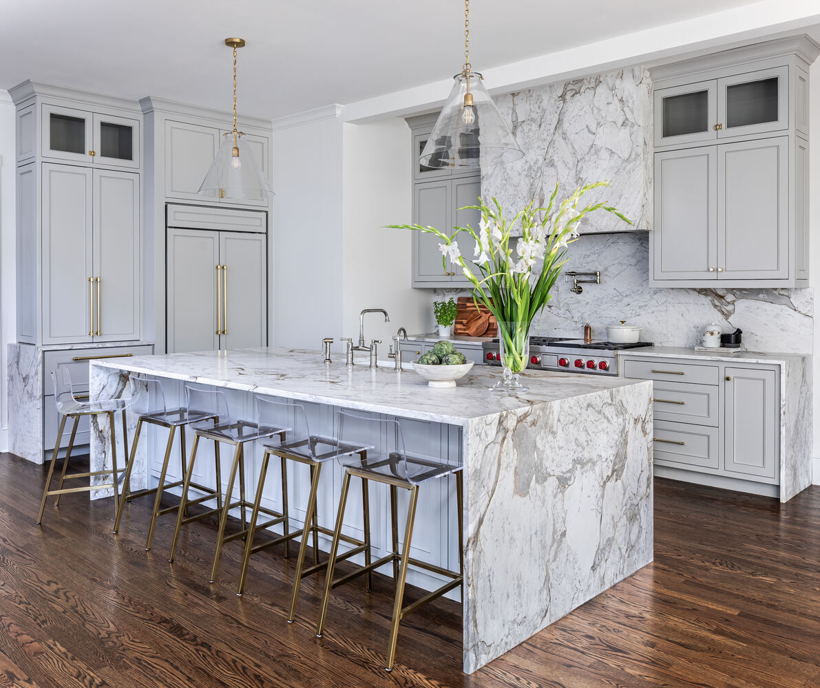 Bright and spacious custom kitchen by Exodus Design Build with gold hardware and luxury finishes in Lawrenceville, GA.