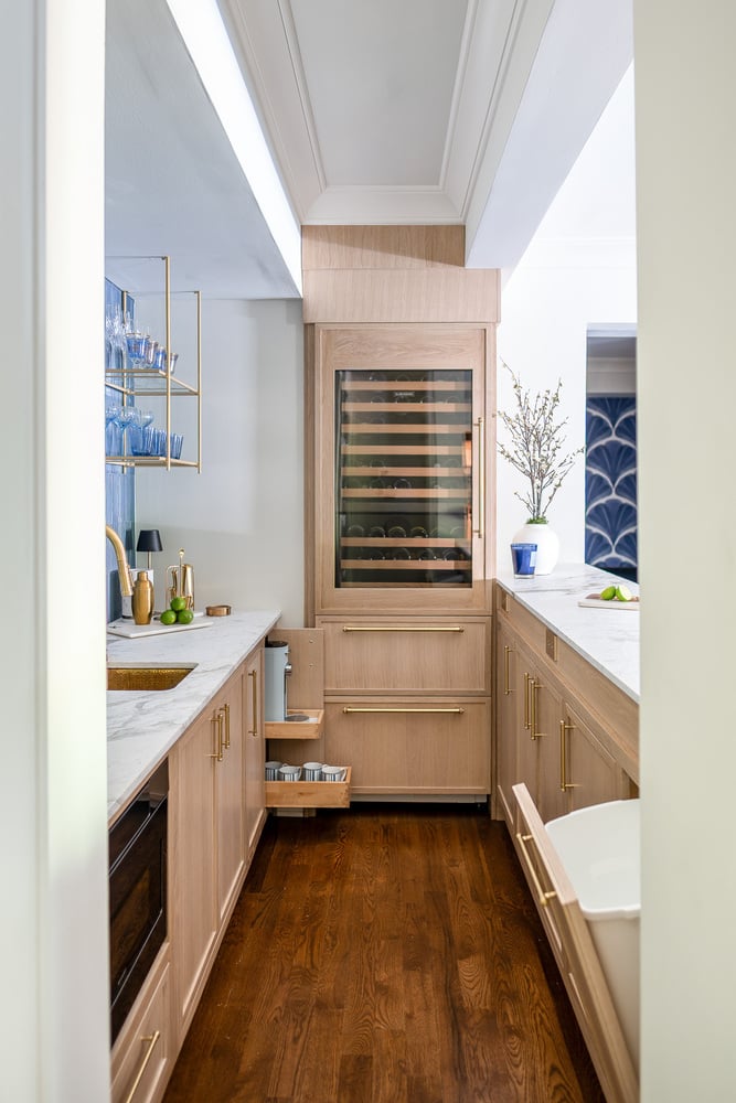 Custom wet bar cabinetry with drawers open, designed by Exodus Design Build in Redan, GA
