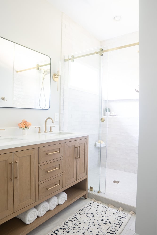 Clean and modern bathroom design with natural wood tones by Exodus Design Build in Gainesville, GA.