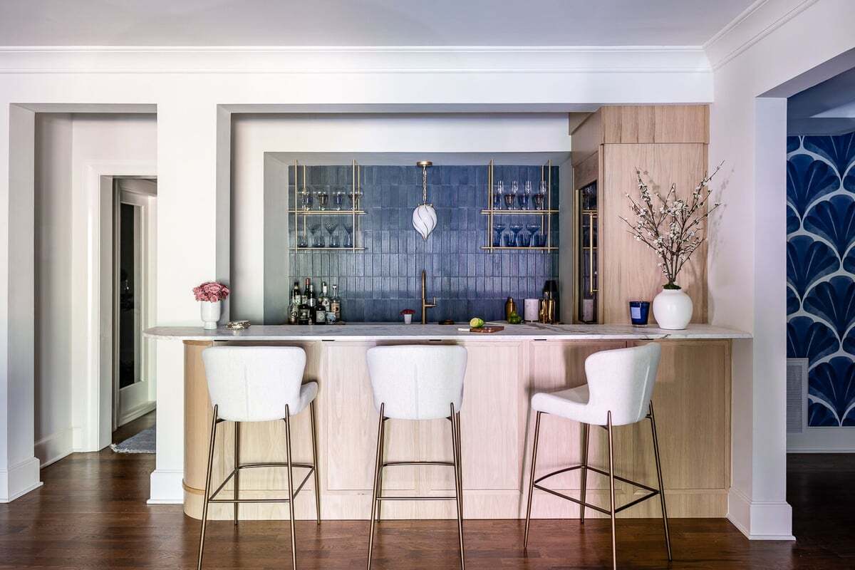 Modern home bar area featuring gold fixtures and open shelving by Exodus Design Build in Berkeley Lake, GA.jpg_width=1200&length=1200&name=Modern home bar area featuring gold fixtures and open shelving by Exodus